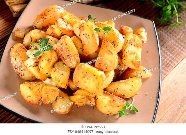 Fried potatoes with rosemary and thyme