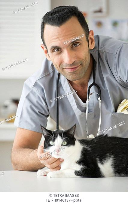 Vet stroking cat in pet clinic