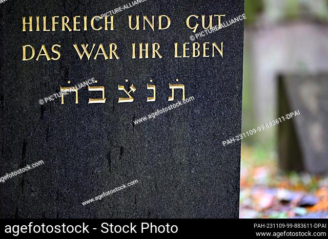 09 November 2023, North Rhine-Westphalia, Cologne: ""HILFREICH UND GUT DAS WAR IHR LEBEN"" is written on a gravestone in the Jewish cemetery