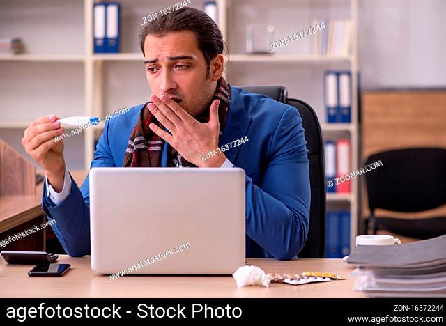 Sick businessman employee suffering at workplace