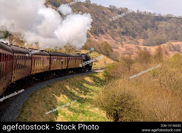 Near Goathland, North Yorkshire, England, UK - May 07, 2016: A train on the The North Yorkshire Moors Railway on the way between Whitby and Pickering