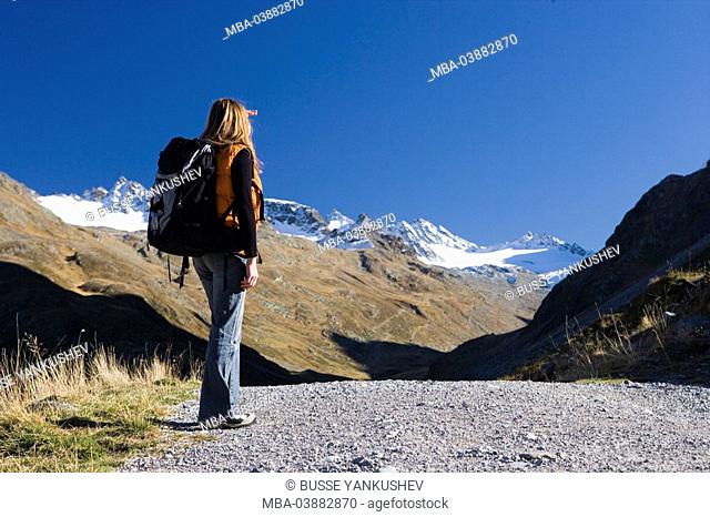 Austria, Vorarlberg, Montafon, Silvretta, woman, backpack, viewpoint, back view