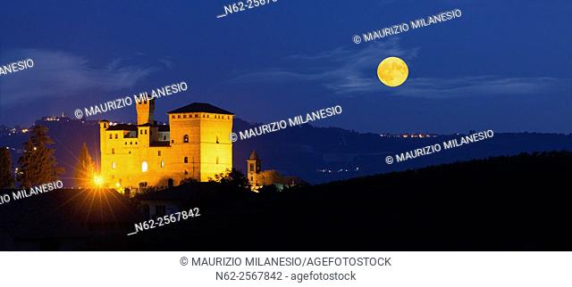 View in the night with a full moon on the Castle of Grinzane Cavour Unesco heritage in the territory of the Langhe Piedmont Italy