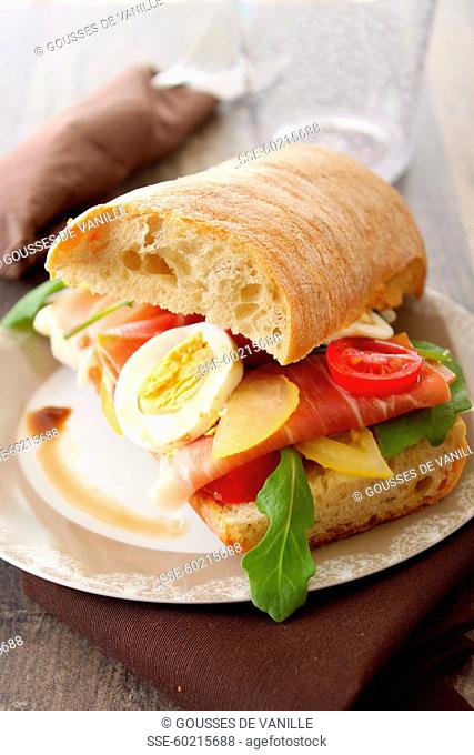 Raw ham and vegetable ciabatta sandwich