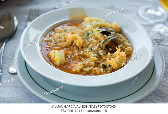 Seafood rice. Very soupy. The real Portuguese style