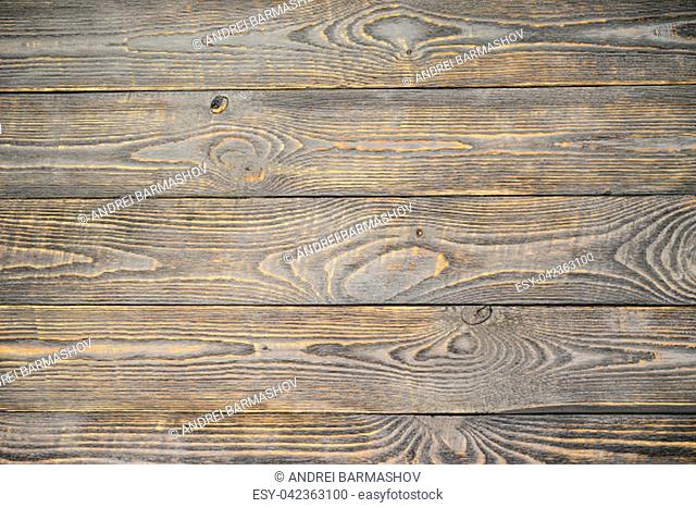 Background of wooden texture boards with yellow color remnants of gray paint