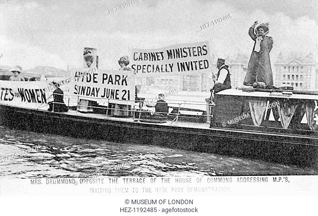 'General' Mrs Drummond in a boat opposite the terrace of the House of Commons, 1908. She is on the far right of the picture addressing MPs and inviting them to...