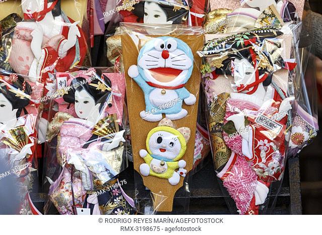 A Hagoita (Battledore) decorated with the manga series character Doraemon (C) on display during the Hagoita-Ichi fair at the Sensoji Temple in Asakusa
