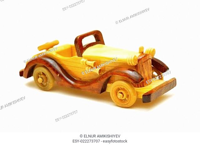 Wooden model of retro car isolated on white