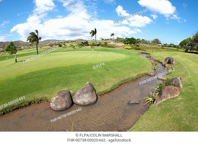 Stream running by practice green on golf course, Le Telfair Hotel and Golf Course, Bel Ombre, Southwest Mauritius