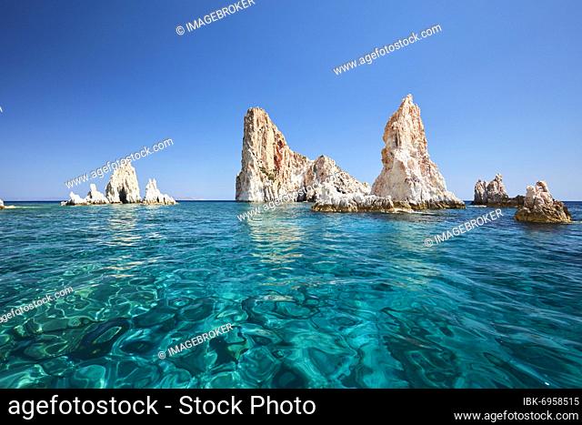 Rocks rising from the water off the coast of Polyaigos next to Milos, Cyclades, Greece, Europe