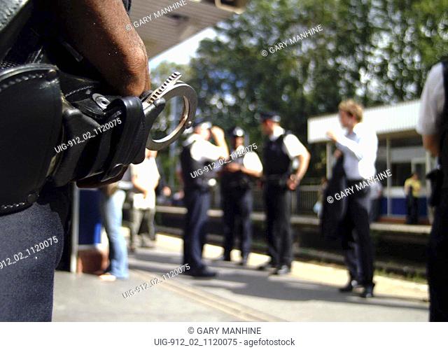 UK immigration officials at Dalston Kingsland train station; Hackney London 2003 UK