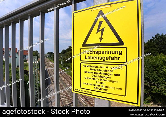 22 July 2020, Bavaria, Weißensberg: On a bridge over the Munich-Lindau railway line, which has been fitted with new masts and power lines