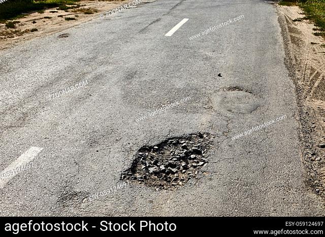 Very bad quality road with potholes, repair needed