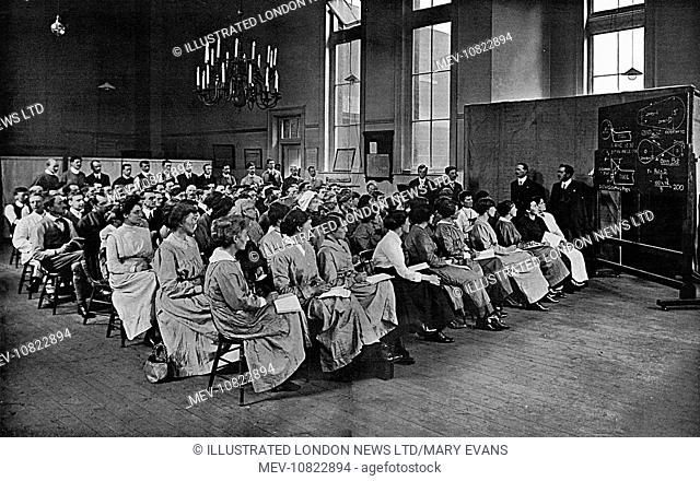 Women and men together studying the theory of machine tool using at the Shoreditch Technical Institute during the First World War