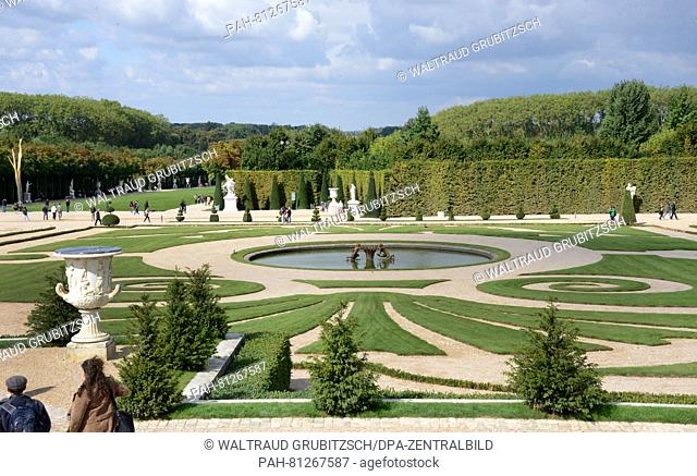 Visitors walk through the park of the Palace of Versailles on the outskirts of Paris, Germany, 10 September 2008. The former hunting of Louis XI
