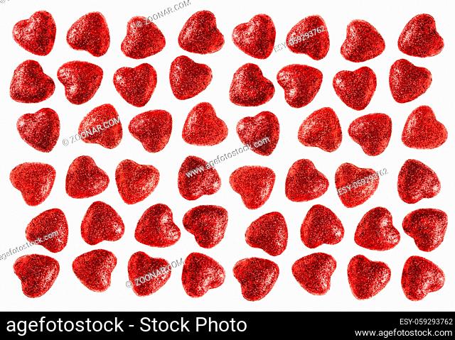 Many small glitter red hearts isolated on white background - love and valentine concept