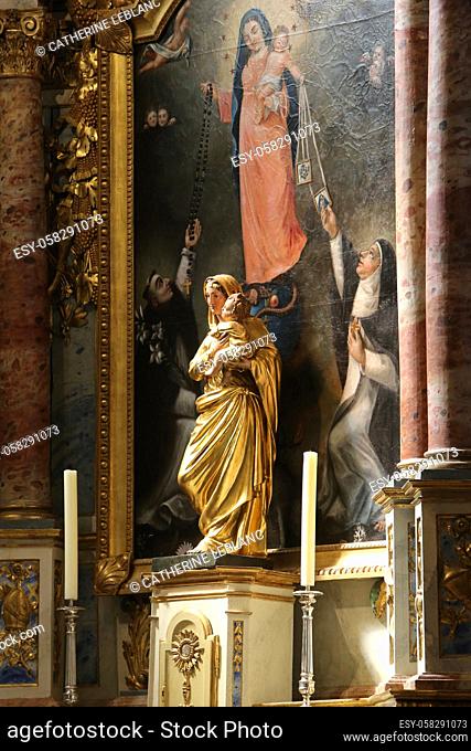 Virgin and Child. Statue and Painting. Church of Saint-Gervais-et-Protais. Saint-Gervais-les-Bains. Haute-Savoie. Auvergne Rhône-Alpes. France. Europe