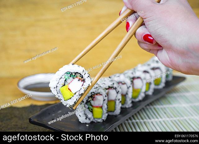 California roll on beautiful decorated plate