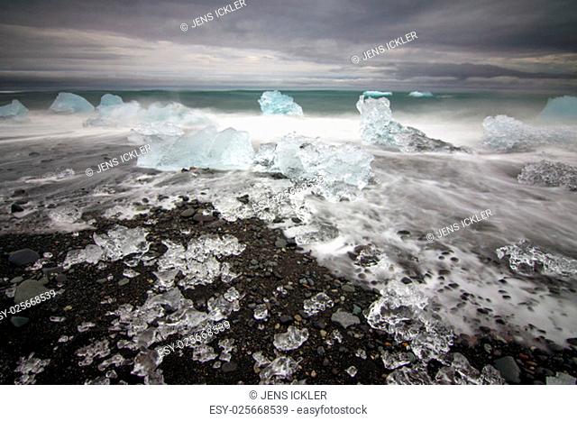 beach with pieces of ice on the glacier lagoon jokulsarlon in iceland