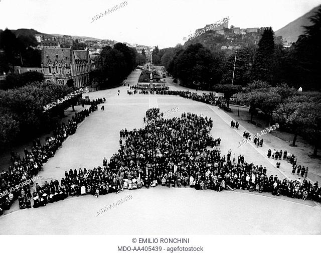 A procession in the square of the basilica of Our Lady of the Rosary . A procession in the square of the basilica of Our Lady of the Rosary during the centenary...