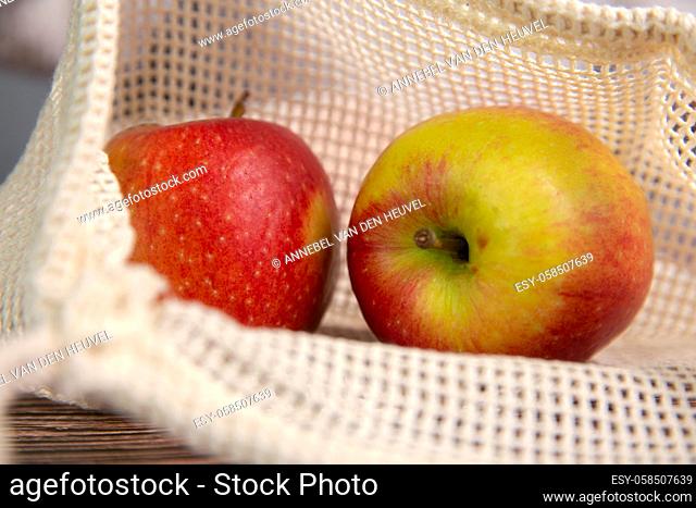 apples in an environmentally friendly bag, Eco friendly bag with red fresh apples with copy space, Fruit, Health, environment concept space for text