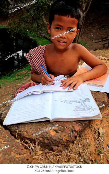 Boy studying, Cambodia