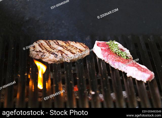 Preparing meat on the grill, concept of cooking and Haute cuisine