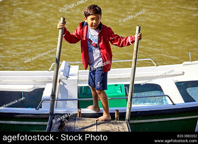 Child 5-10 years on the jetty, Zumaia, Gipuzkoa, Basque Country, Spain