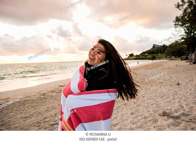 Woman swinging hair, Kailua Beach, Oahu, Hawaii