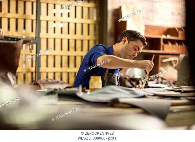 Man working in leather workshop