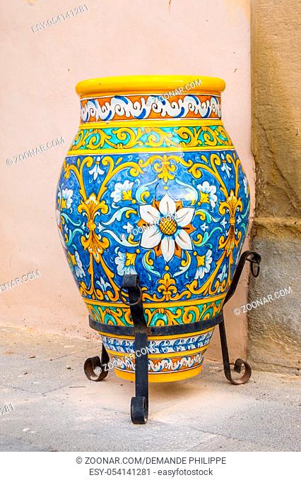 Ceramic jar decorated with floral motifs placed on a foot in the city of Santo Stefano di Camastra in northern Sicily