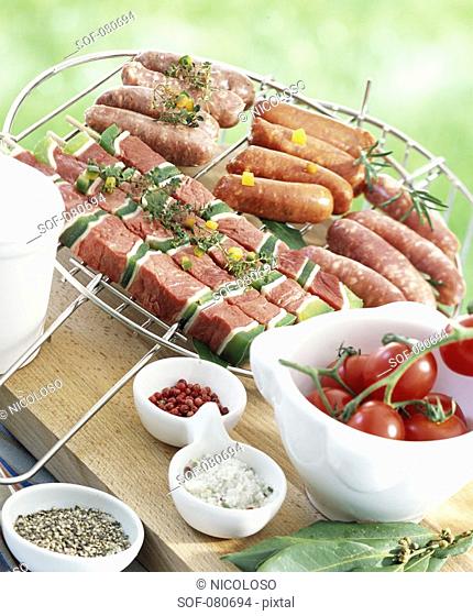 Selection of raw brochettes and mini sausages