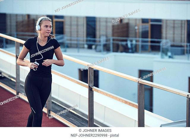 Woman with headphones jogging