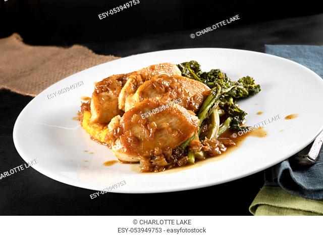 Chicken breast medallions with shallot marsala gravy, polenta and broccoli rabe