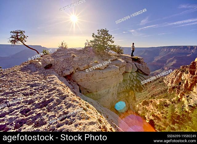 Man hiking on a ridge of rock east of Shoshone Point at Grand Canyon Arizona