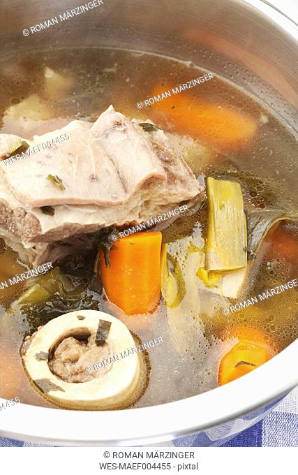Beef broth in stew pot, close up