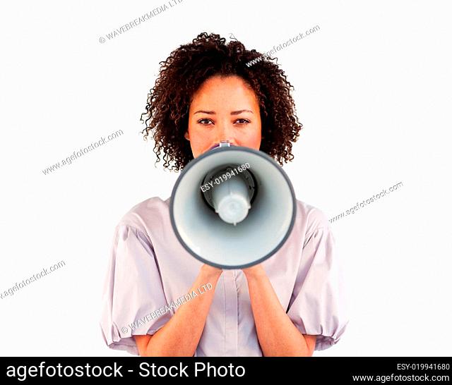 Businesswoman speaking through a megaphone in front of the camera
