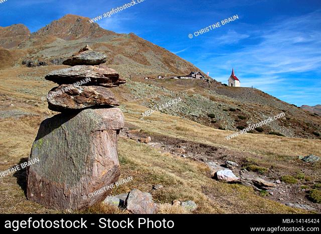 latzfons, sarntal alps, bolzano province, south tyrol, italy, europe. the shelter and the pilgrimage church latzfonser kreuz (2311m) in the background left the...