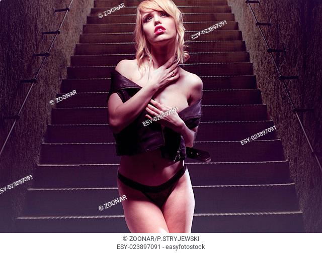 Sexy Young Woman Posing at Stairs Provocatively
