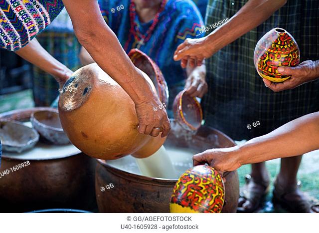 Women serving chilate drink in typical cups, Rabinal achi celebration, Rabinal, Guatemala