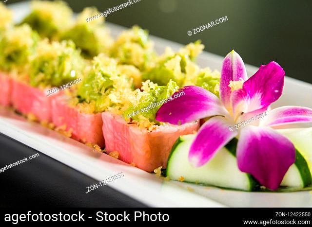 Close up of sushi on a white plate