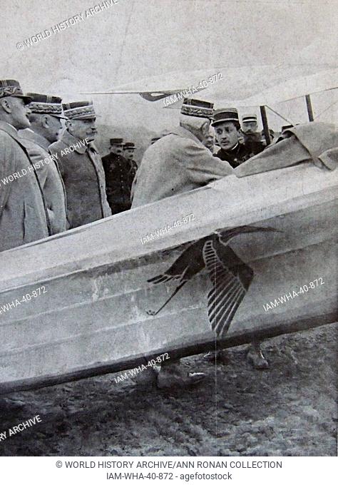 General Foch and senior army officers greet French air ace pilot Captain Guynemer besides an aircraft of the French army 1917aircfraft in September 1916