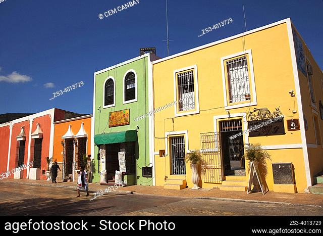 Woman wearing traditional Yucateca dress in front of the colonial buildings at the historic center, Valladolid, Yucatan Province, Mexico, Central America