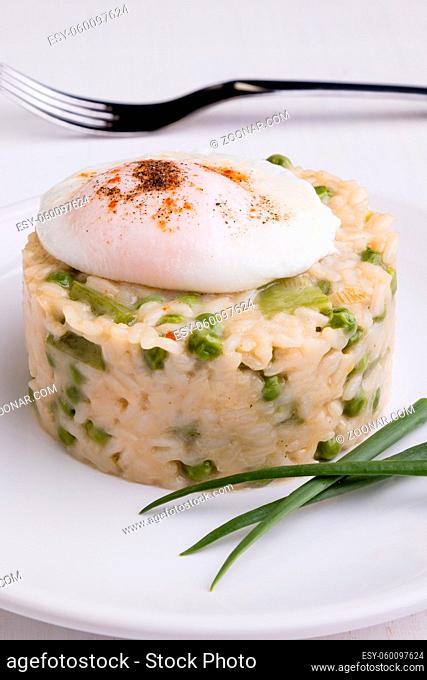 fresh vegetarian pea risotto with poached egg