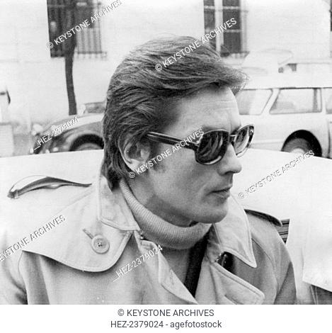 French film star Alain Delon arriving at the Palais de Justice, Versailles, France, late 1960s. Alain Delon (1935-) was questioned by police after one of his...