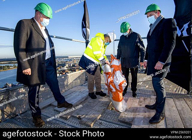 Antwerp alderman Fons Duchateau and Antwerp Mayor Bart De Wever pictured during the placement of a new rooster weather vane on the the Cathedral of our Lady...