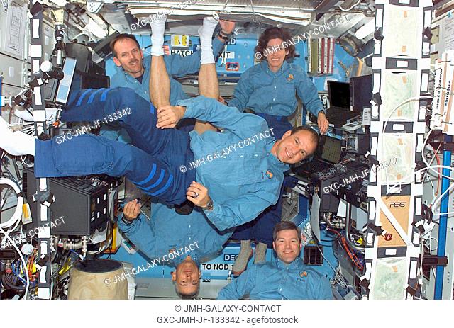 Astronauts Michael J. Bloomfield (foreground), STS-110 mission commander; Stephen N. Frick (bottom right), pilot; Steven L