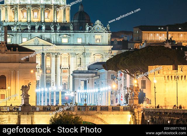 Rome, Italy. St. Peter's Square With Papal Basilica Of St. Peter In The Vatican And Aelian Bridge In Evening Night Illuminations