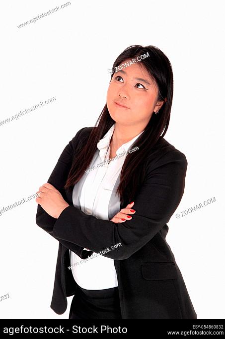 A beautiful young Chinese woman in an portrait image with her long black hair, looking up for a solution, isolated for white background